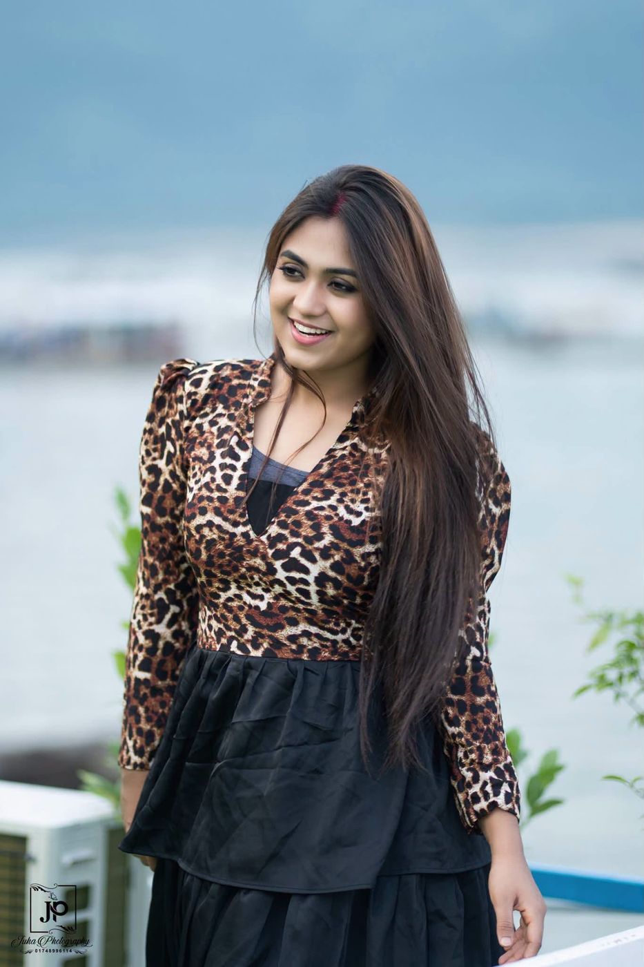Sathi's Beauty Lounge brand promoter with long, glossy hair